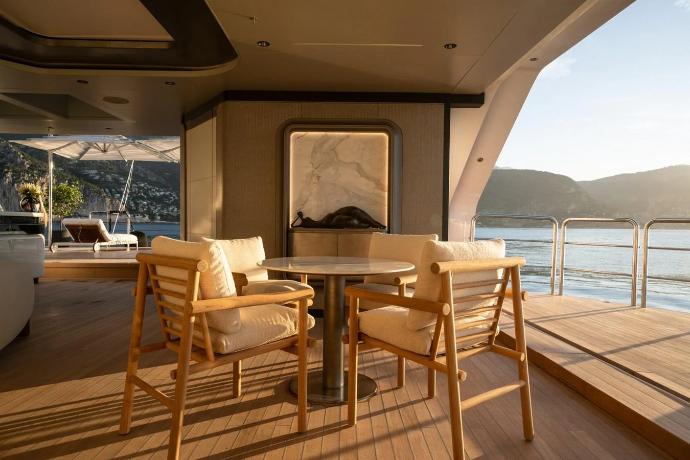 The aft deck offers a serene seating area with a stunning view of the water and surrounding landscape. aboard MALIA Yacht for Sale