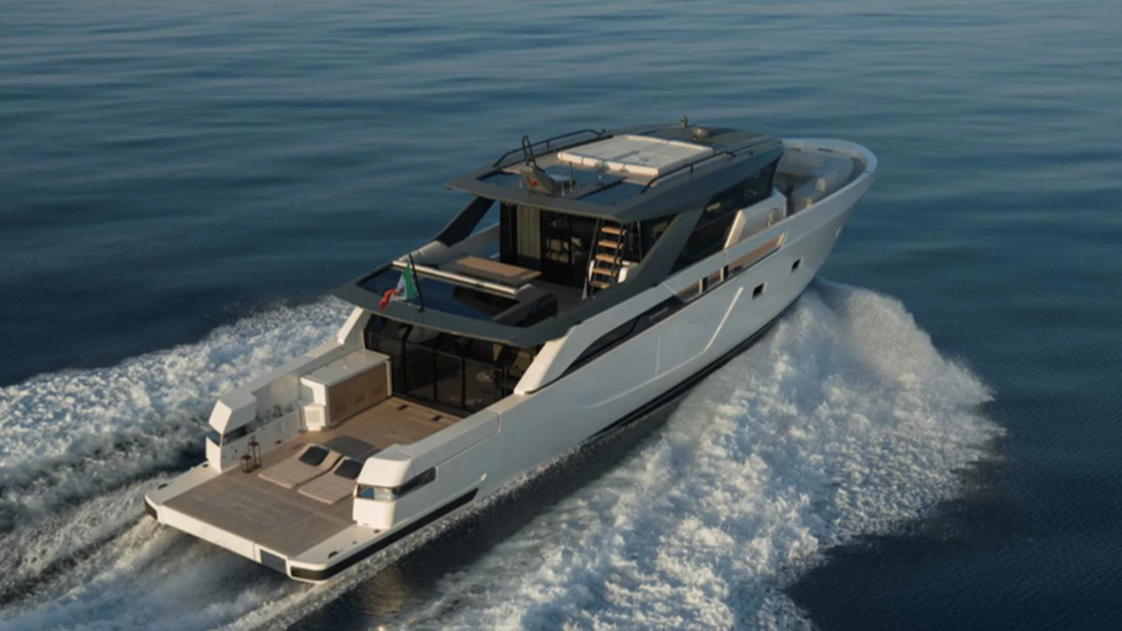 A sleek and modern yacht cruises smoothly on calm waters, showcasing its elegant design and spacious deck. aboard BARIC Yacht for Sale