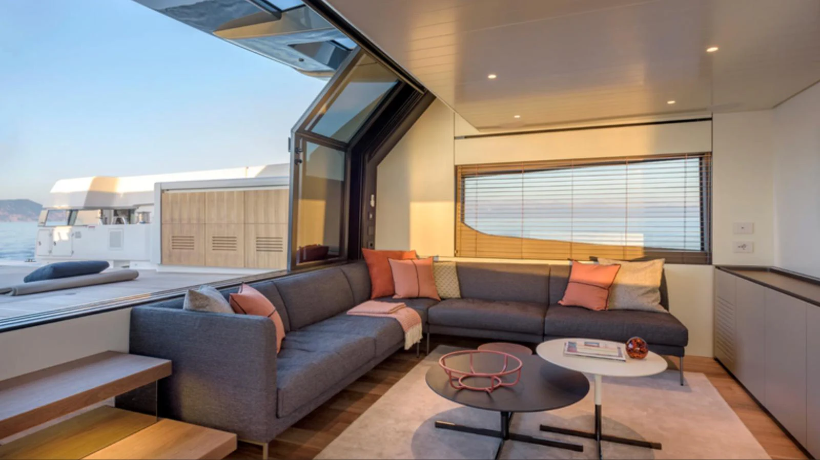 The salon features a spacious seating area with modern furnishings and large windows providing ample natural light. aboard BARIC Yacht for Sale