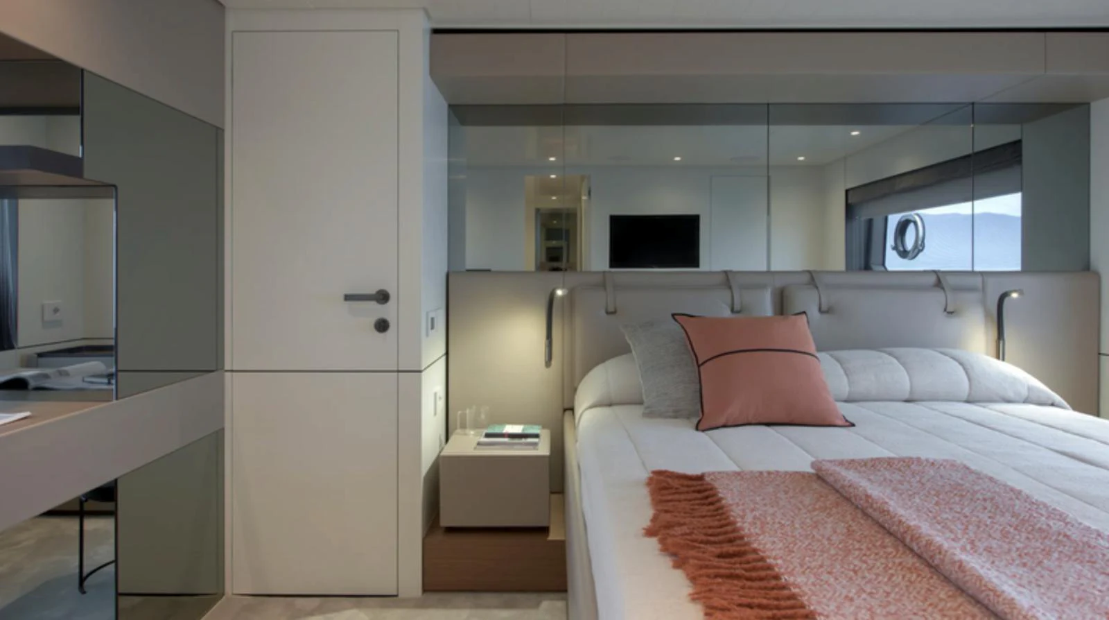 A luxurious stateroom featuring a comfortable bed with elegant bedding and modern decor. aboard BARIC Yacht for Sale
