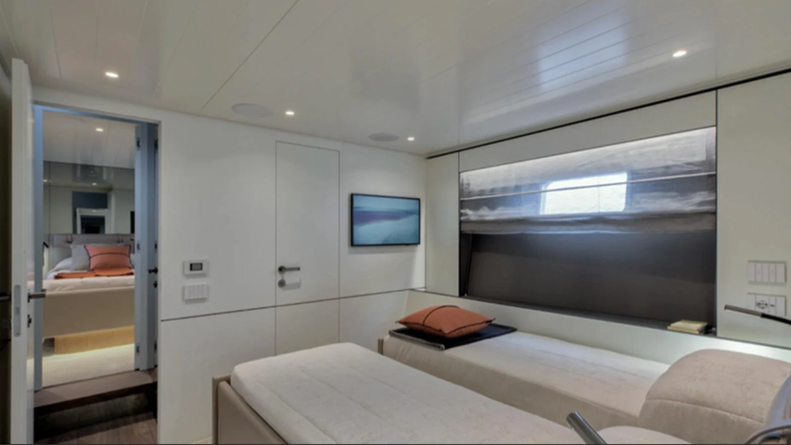 The guest cabin features twin beds and modern decor, providing a comfortable and stylish retreat. aboard BARIC Yacht for Sale
