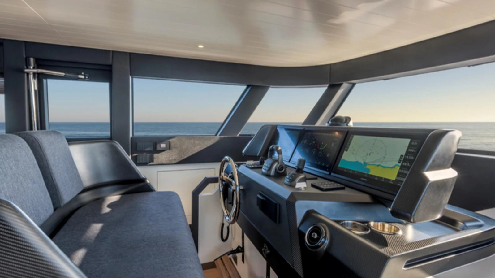 The helm station offers a modern and sleek design with advanced navigation equipment and comfortable seating. aboard BARIC Yacht for Sale