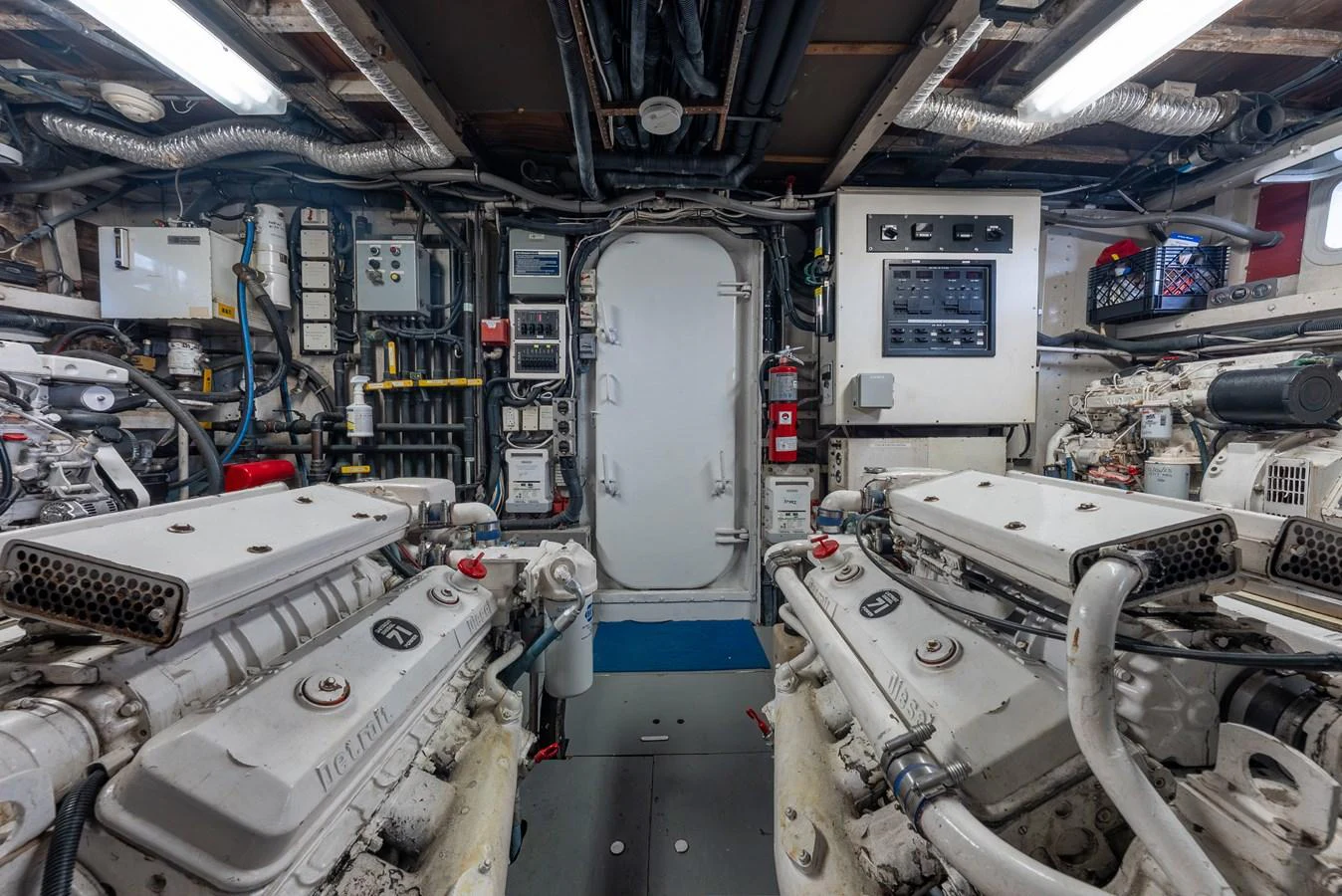 The engine room showcases powerful machinery and advanced systems for optimal yacht performance. aboard INNISFAIL Yacht for Sale