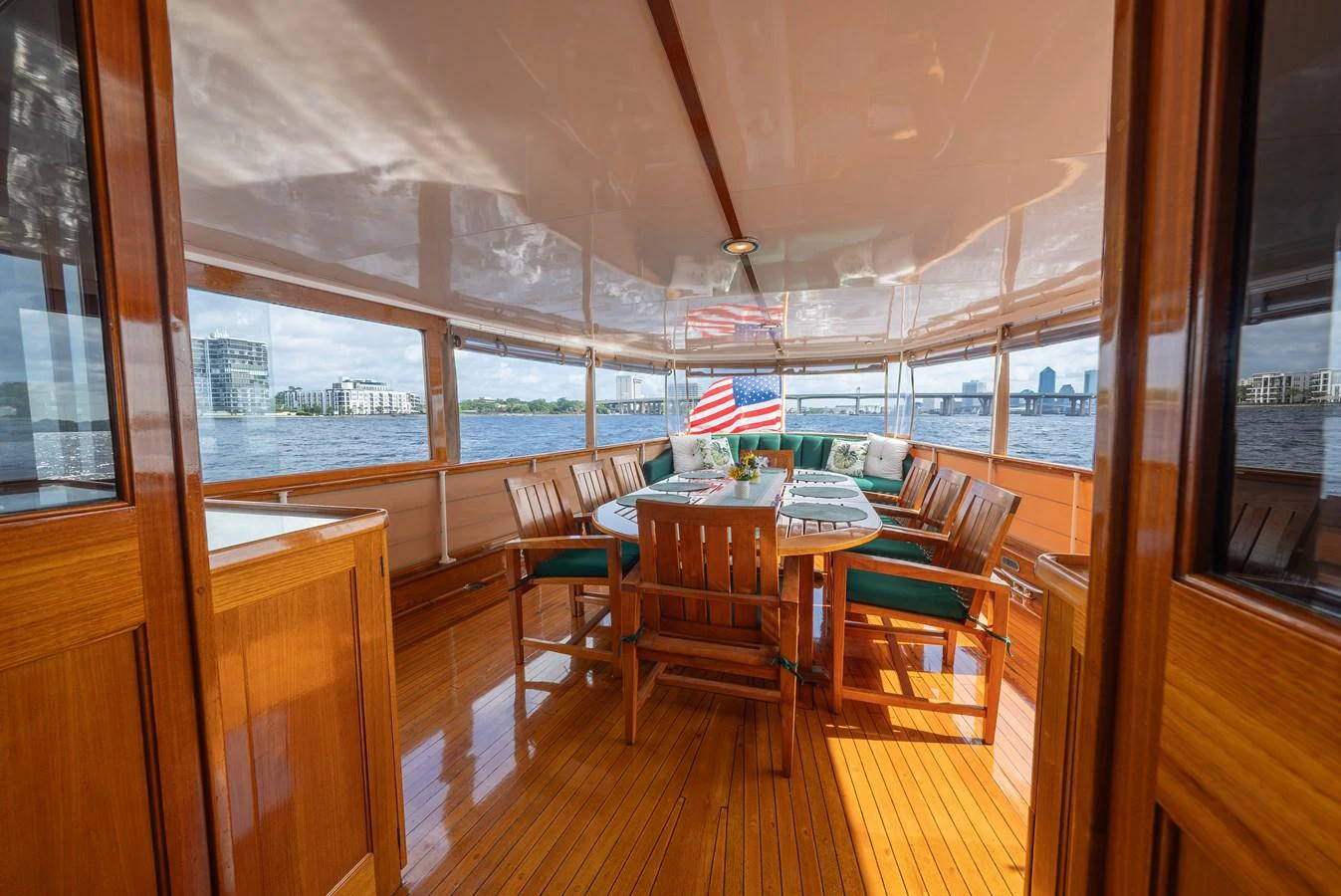 The aft deck features a spacious dining area with panoramic views of the surrounding waters. aboard INNISFAIL Yacht for Sale