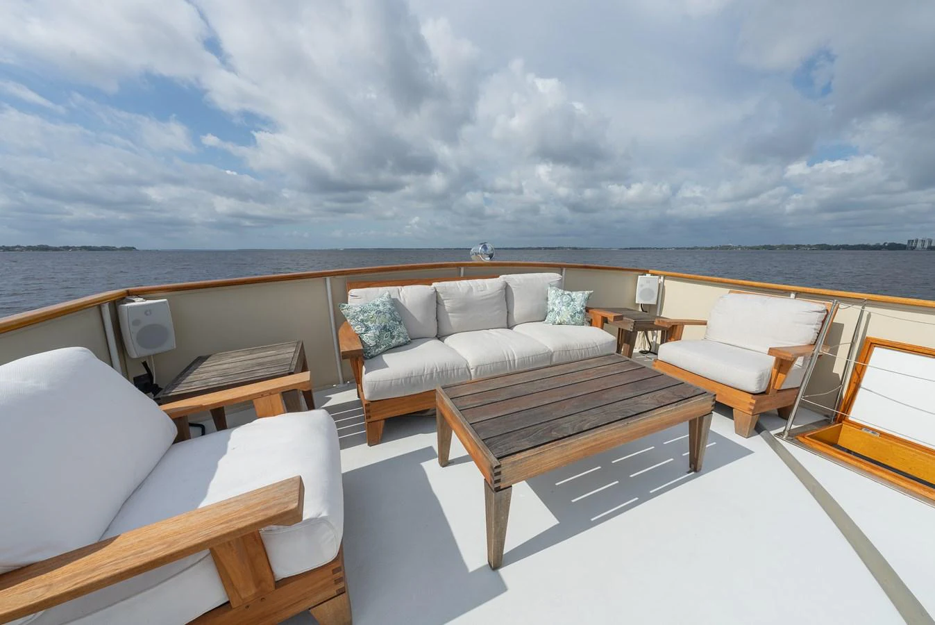 The aft deck offers a comfortable seating area with a stunning view of the open water. aboard INNISFAIL Yacht for Sale