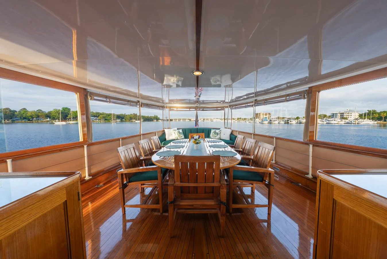The yacht's dining area offers a serene and elegant setting with panoramic views of the surrounding waters. aboard INNISFAIL Yacht for Sale