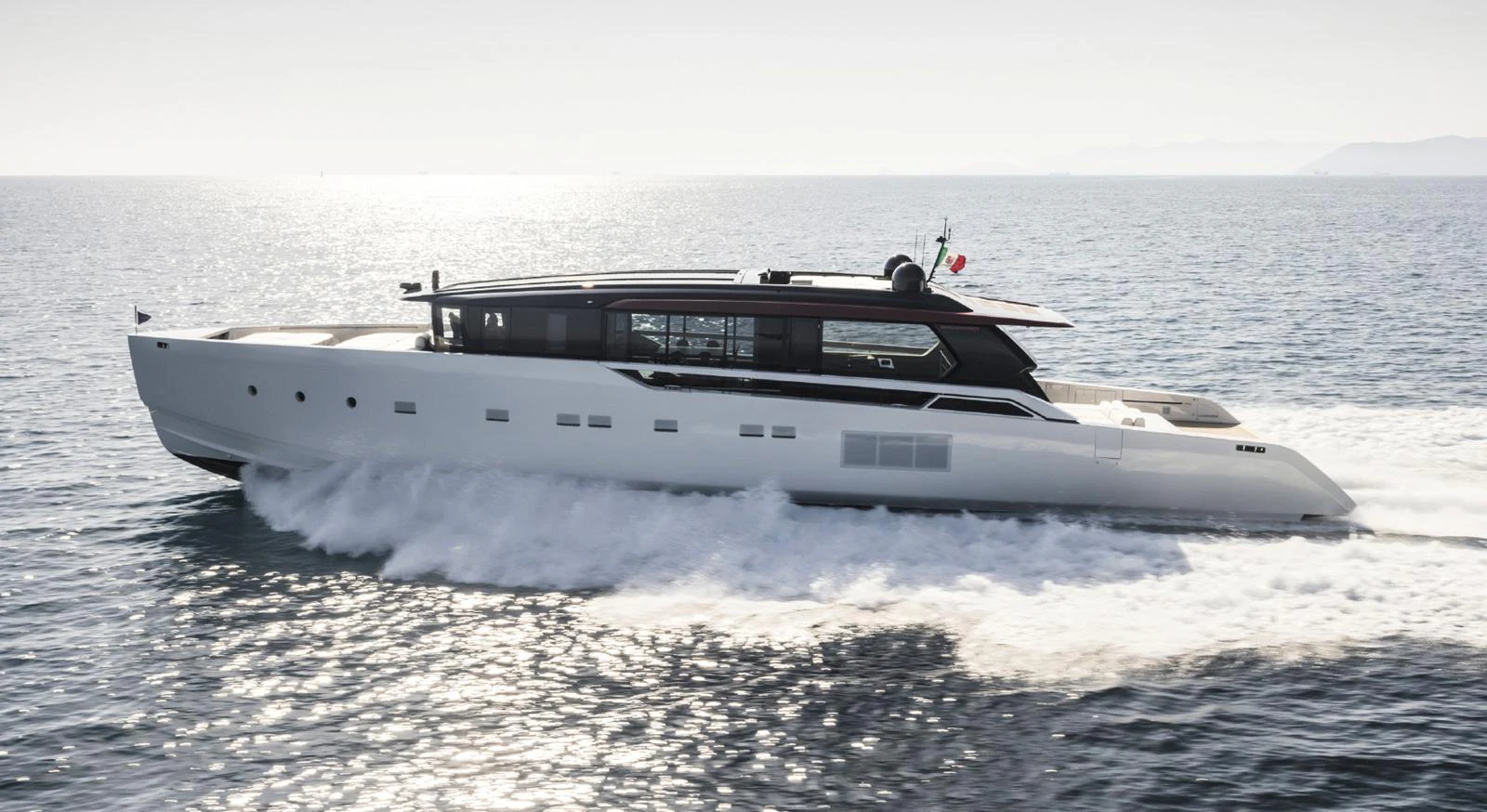 A sleek and modern yacht cruises swiftly on open waters. aboard STEEL IT Yacht for Sale