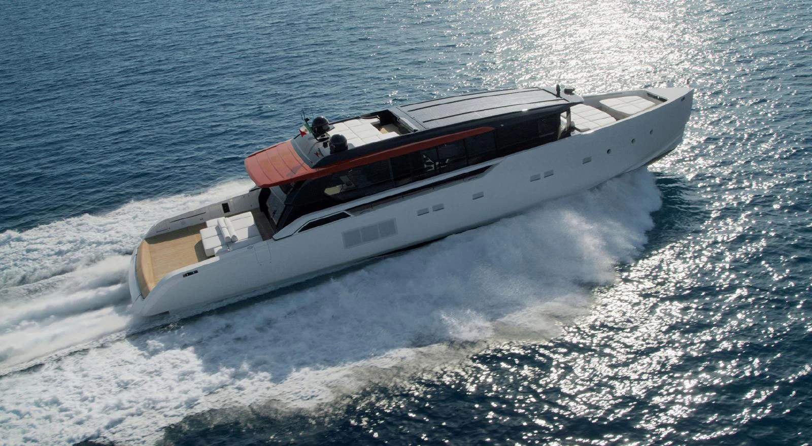 A sleek, modern yacht glides swiftly across the water, showcasing its elegant design and powerful performance. aboard STEEL IT Yacht for Sale