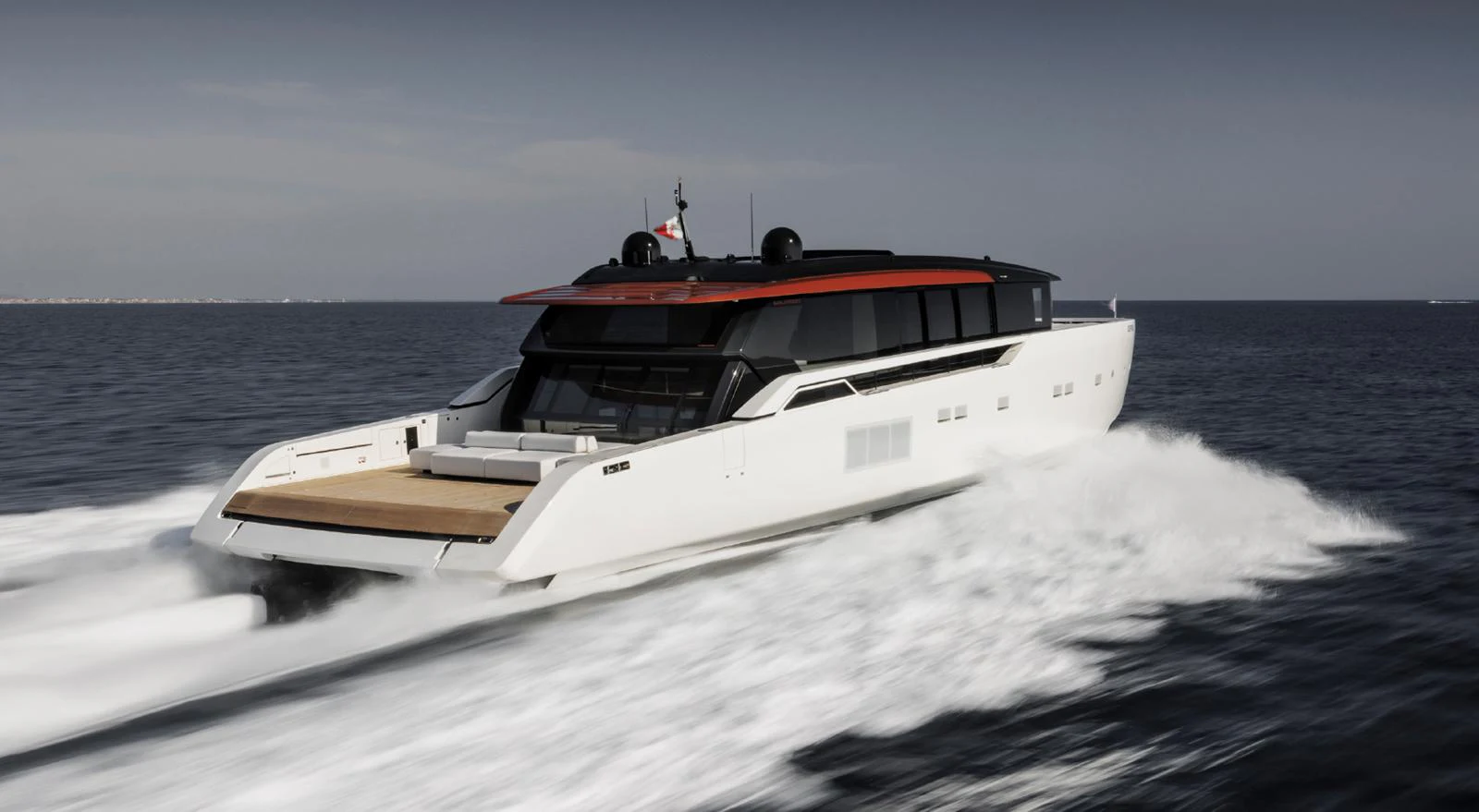 A sleek, modern yacht cruises swiftly across the open water. aboard STEEL IT Yacht for Sale