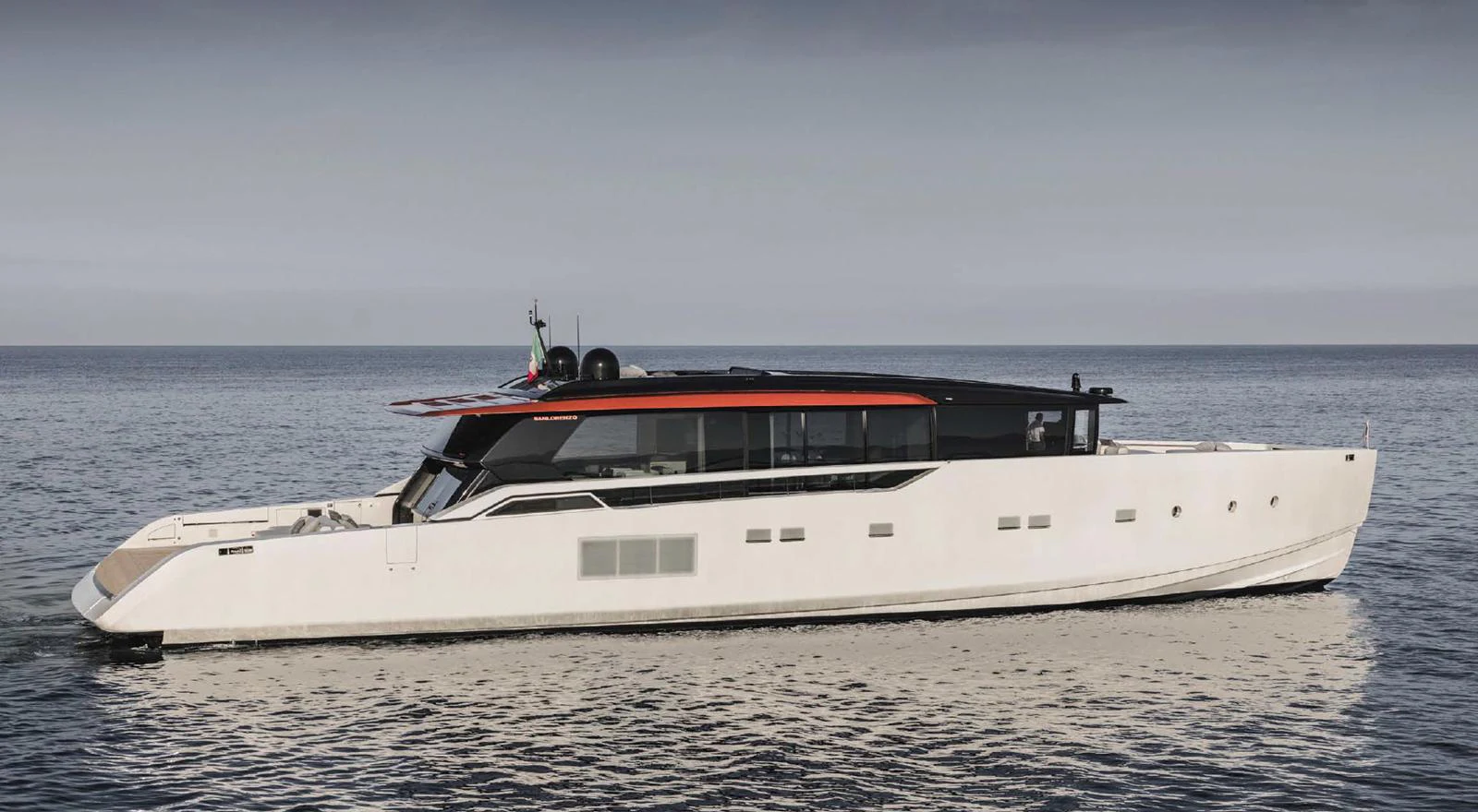 A sleek and modern yacht cruising on calm waters. aboard STEEL IT Yacht for Sale