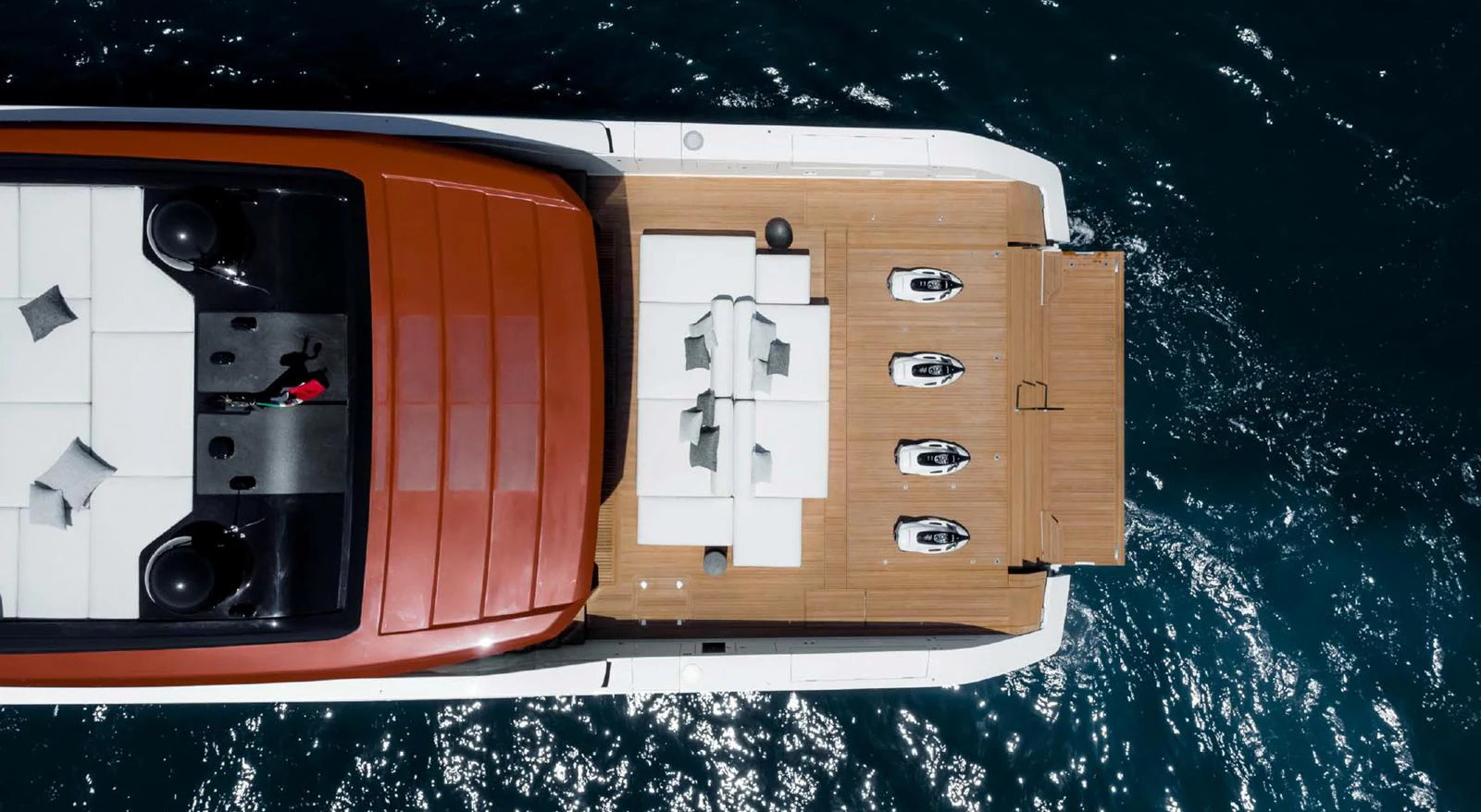 The aft deck features a stylish seating area with a dining table, perfect for alfresco dining. aboard STEEL IT Yacht for Sale