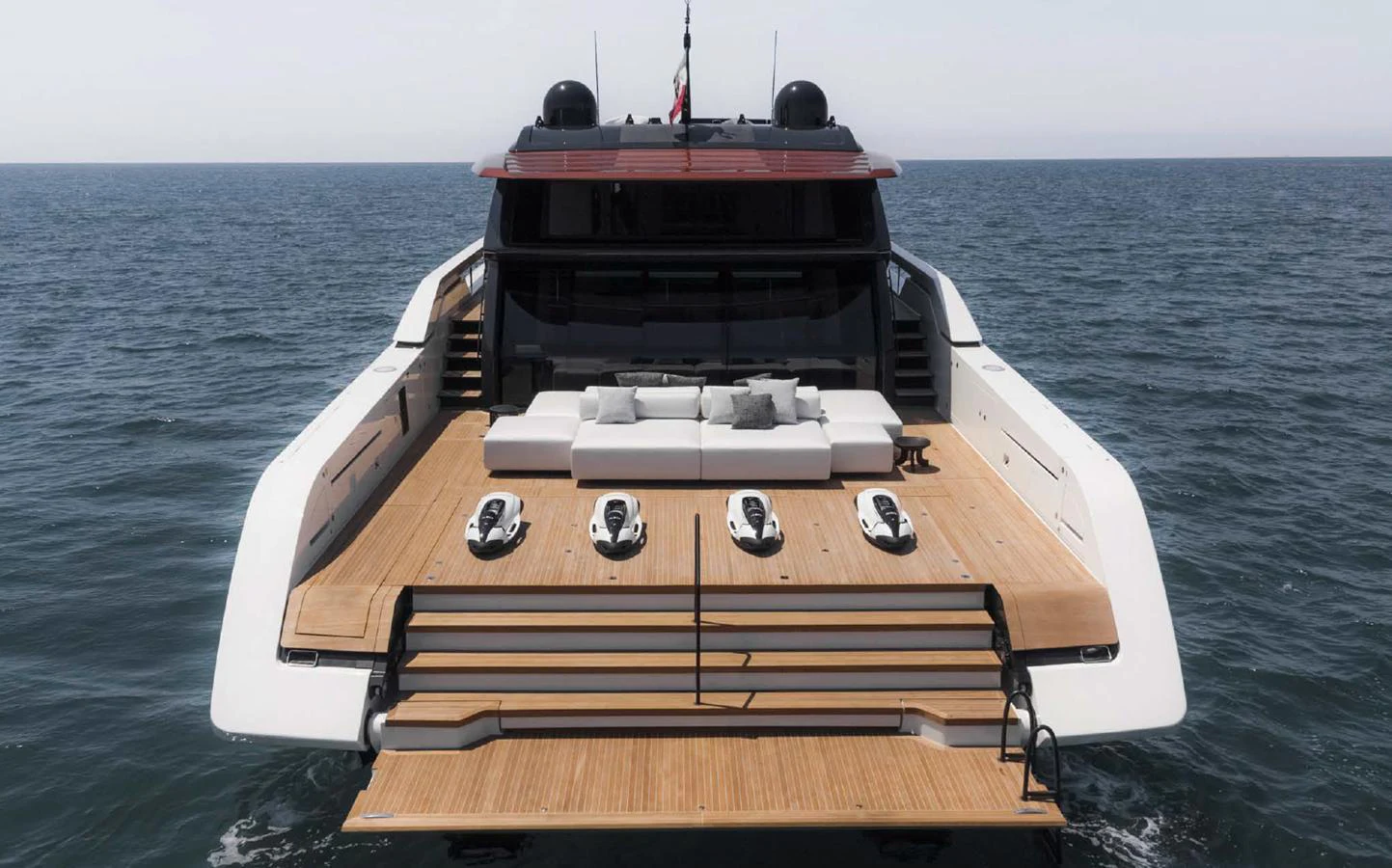 The yacht's aft deck features a spacious lounging area with a sleek, modern design. aboard STEEL IT Yacht for Sale