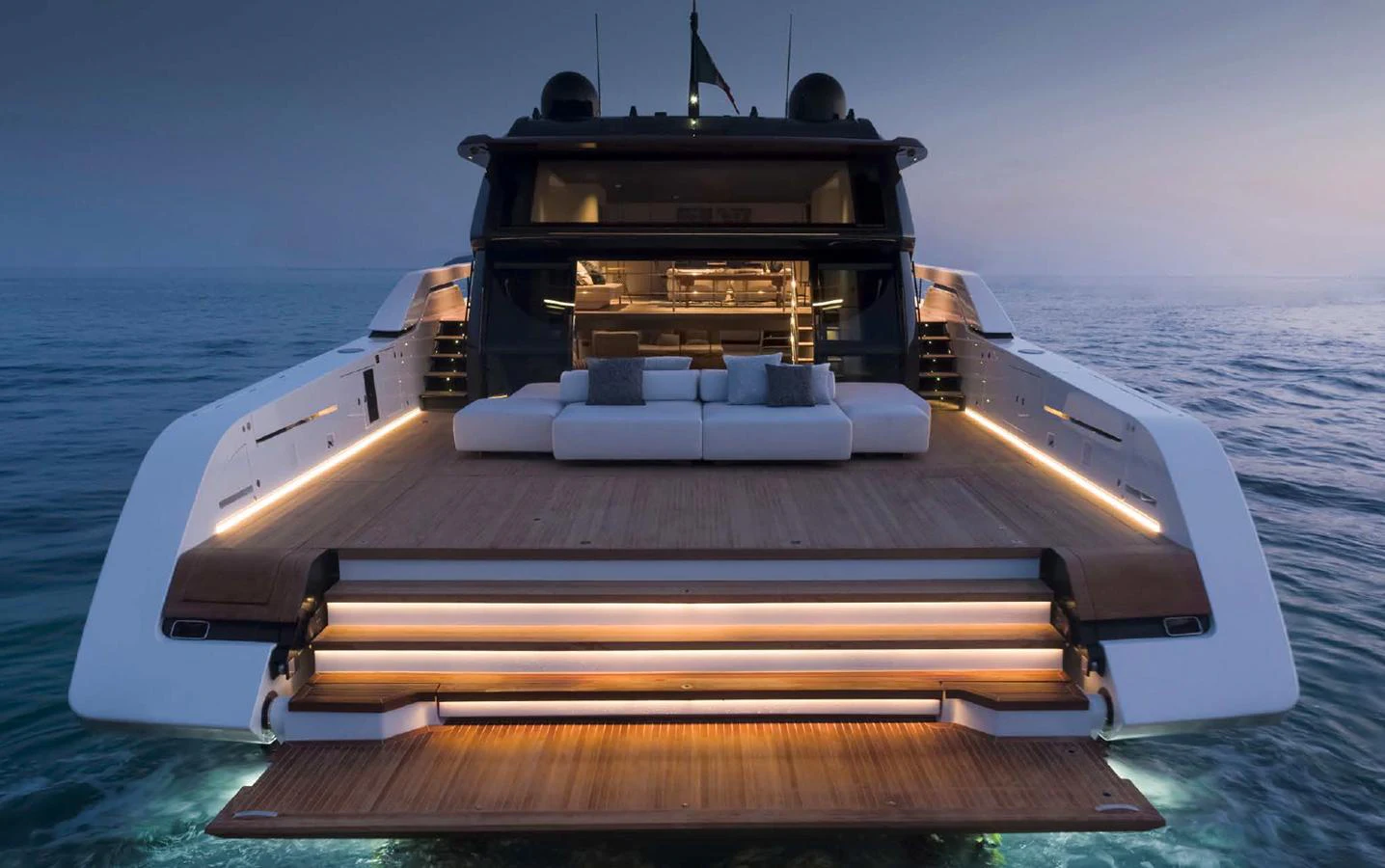 The yacht's aft deck features luxurious seating and ambient lighting, creating an inviting space for relaxation at sea. aboard STEEL IT Yacht for Sale