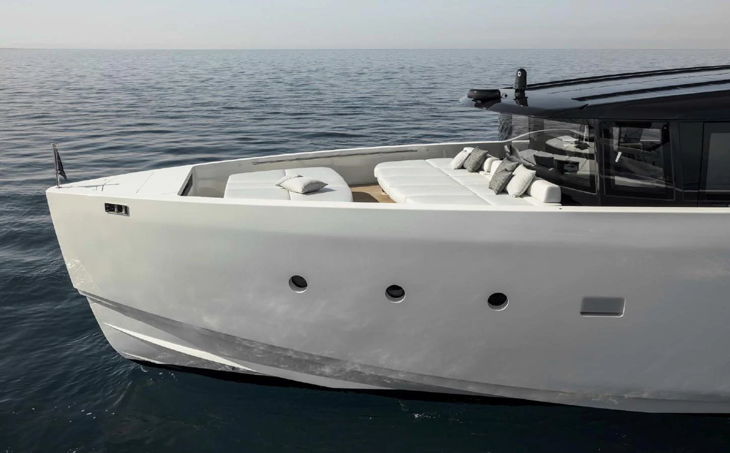 A sleek and modern yacht cruising on calm waters. aboard STEEL IT Yacht for Sale
