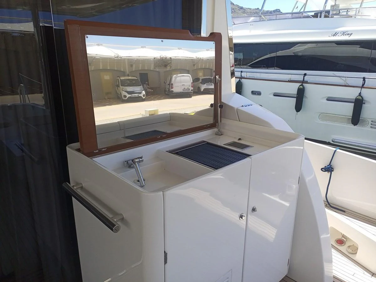 A sleek outdoor kitchenette area on the yacht, perfect for alfresco dining. aboard LIL Yacht for Sale