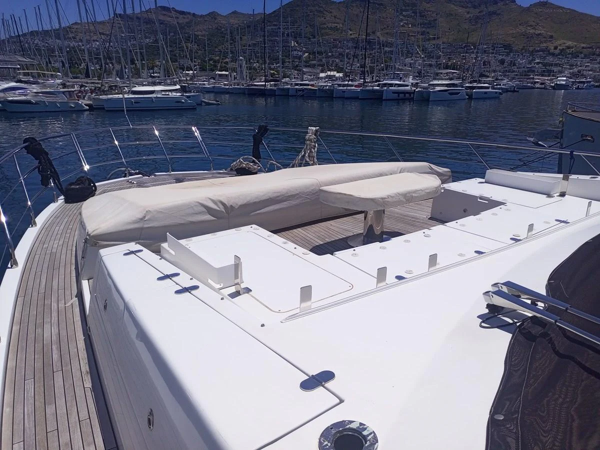 The foredeck of the yacht offers a spacious and inviting area for relaxation with a view of the marina. aboard LIL Yacht for Sale