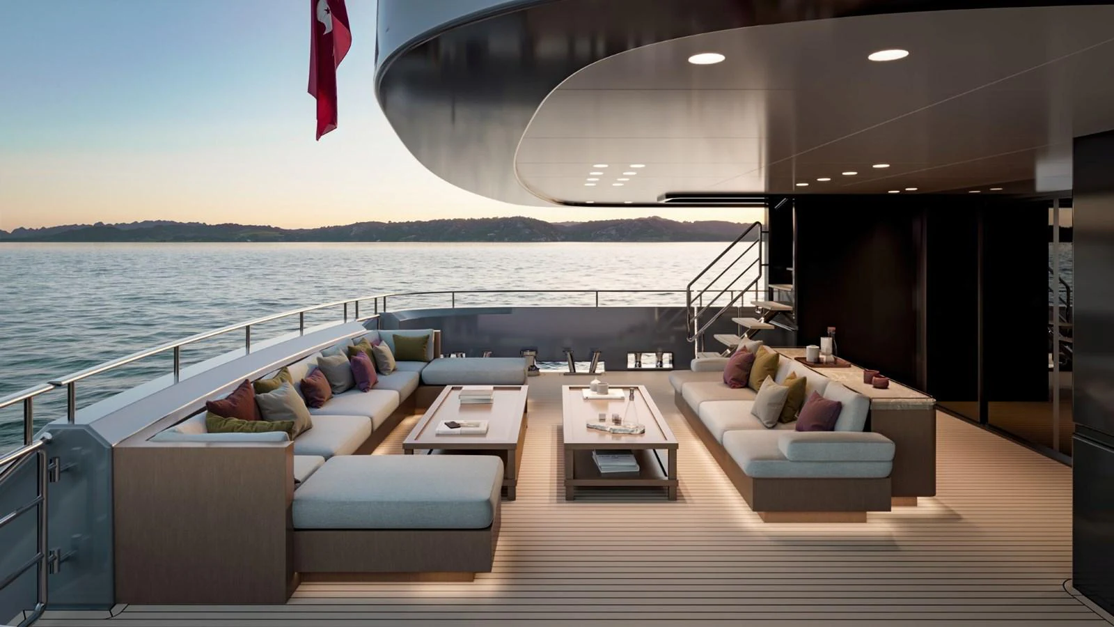 The aft deck features a spacious and elegant seating area with a stunning view of the water. aboard KINGSHIP 45M GRAND EXPLORER Yacht for Sale