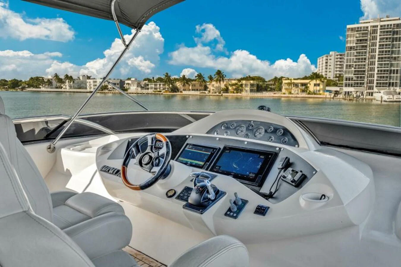 The helm station offers a sophisticated and modern command center with advanced navigation equipment and luxurious seating. aboard SO WHAT WHO CARES Yacht for Sale