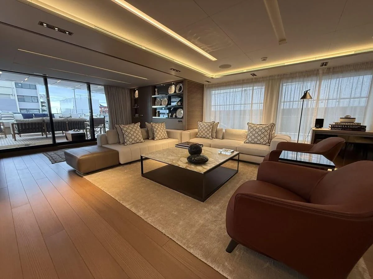 The salon offers a spacious and elegant area with comfortable seating and modern decor. aboard PHOENICIAN Yacht for Sale