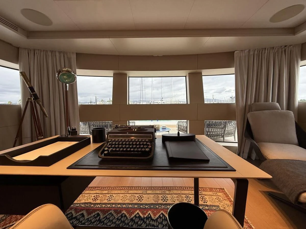 The yacht's office features a sophisticated workspace with a view of the sea. aboard PHOENICIAN Yacht for Sale