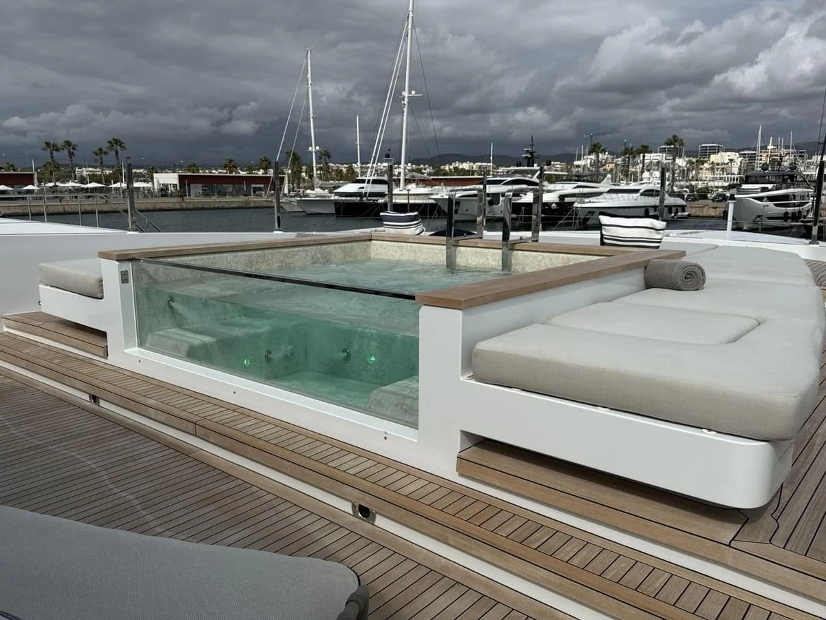 The sundeck features a luxurious jacuzzi surrounded by comfortable sunbeds, perfect for relaxation. aboard PHOENICIAN Yacht for Sale
