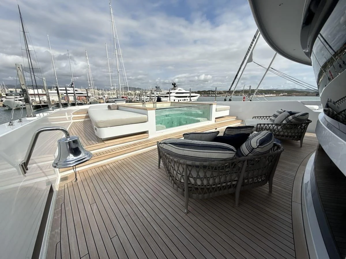 The sundeck features a luxurious lounging area with a jacuzzi and comfortable seating. aboard PHOENICIAN Yacht for Sale