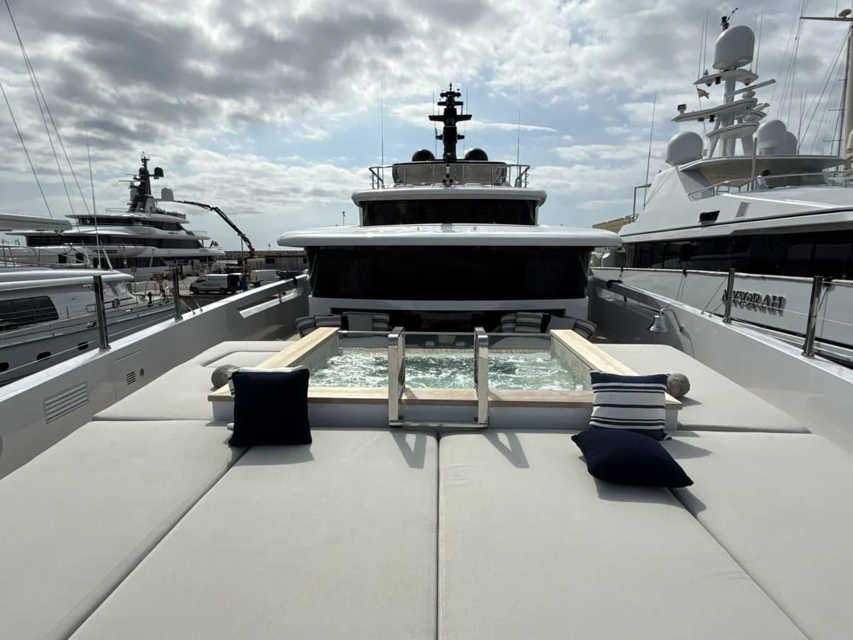 The sundeck features a luxurious jacuzzi surrounded by plush sun pads, perfect for relaxation. aboard PHOENICIAN Yacht for Sale