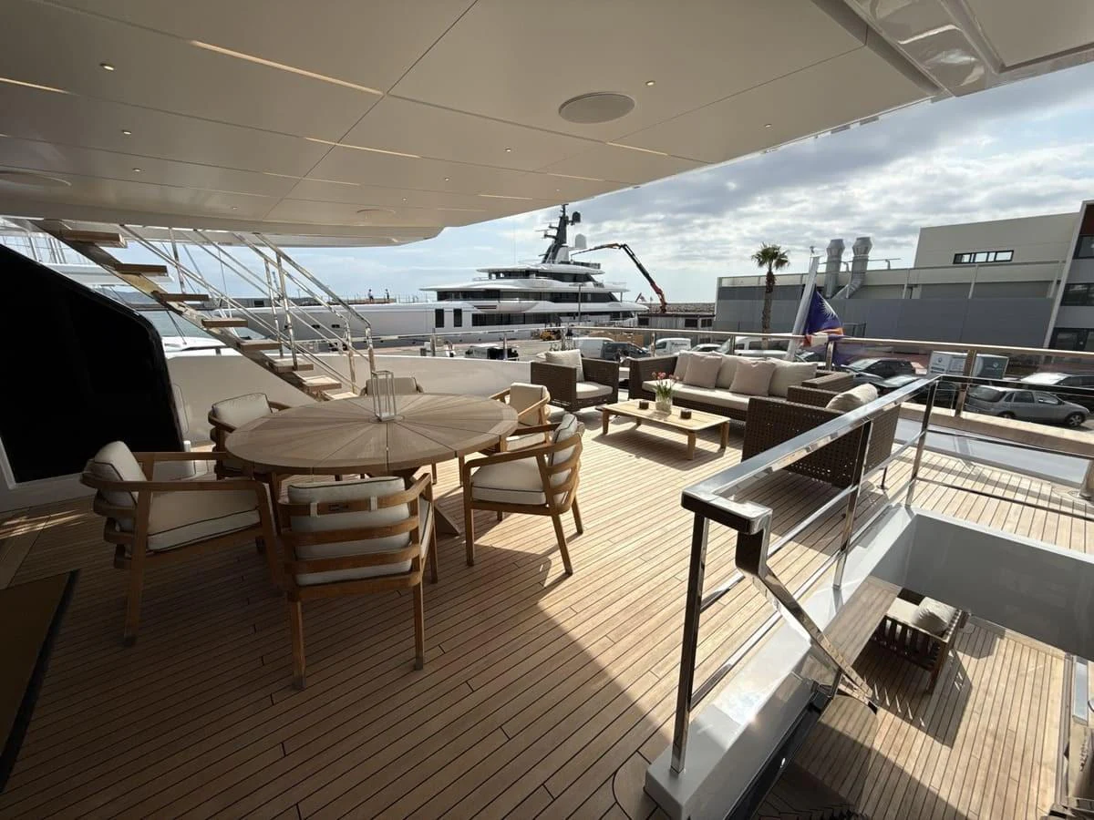 The spacious aft deck features elegant outdoor seating and dining areas, perfect for al fresco gatherings. aboard PHOENICIAN Yacht for Sale