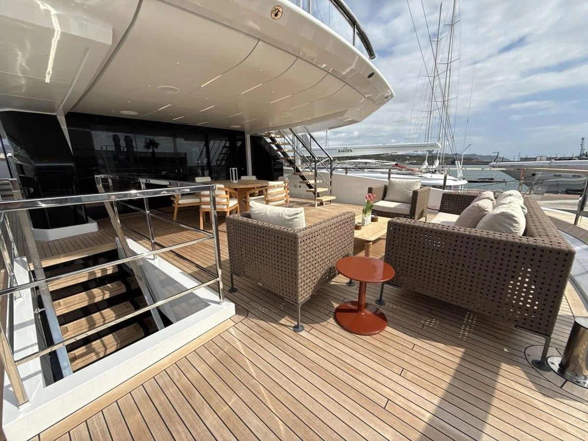 The aft deck offers a spacious and inviting area for relaxation with comfortable seating and a stylish table. aboard PHOENICIAN Yacht for Sale