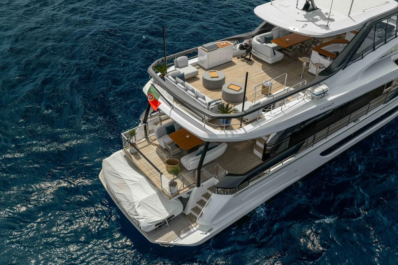 The yacht's aft deck offers a luxurious outdoor living space with elegant seating and dining areas overlooking the water. aboard ST JUDE Yacht for Sale