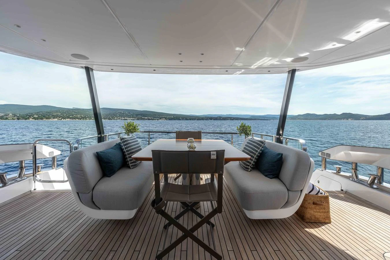 The aft deck offers a serene dining area with comfortable seating and a stunning view of the water. aboard ST JUDE Yacht for Sale