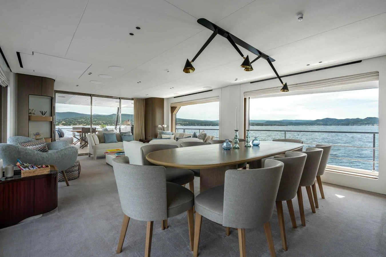 The spacious salon features elegant dining and lounging areas with panoramic views. aboard ST JUDE Yacht for Sale