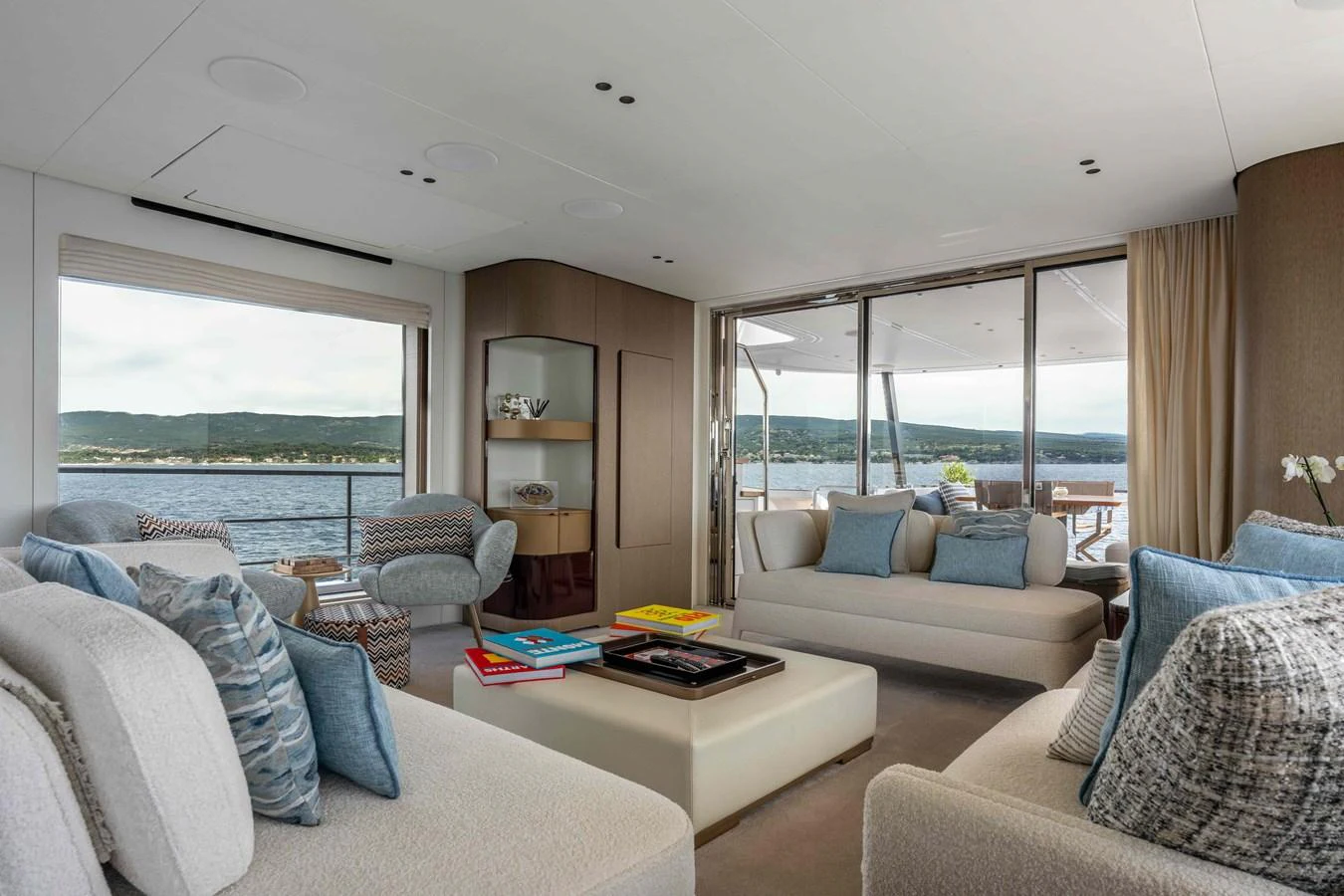 The salon offers a spacious and elegant seating area with panoramic views of the water. aboard ST JUDE Yacht for Sale