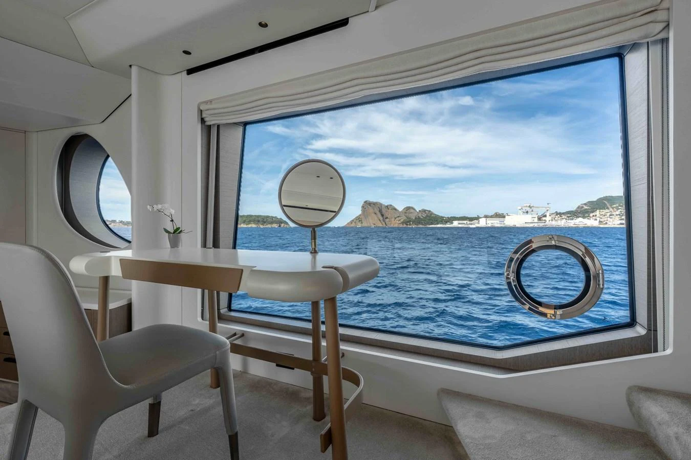 A serene interior space with a large window offering a stunning ocean view. aboard ST JUDE Yacht for Sale