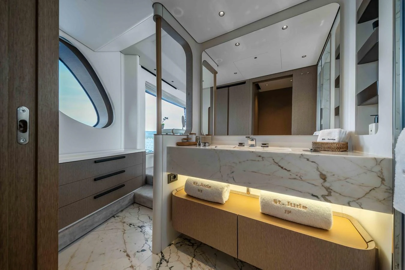 The yacht's bathroom features luxurious marble finishes and modern fixtures. aboard ST JUDE Yacht for Sale
