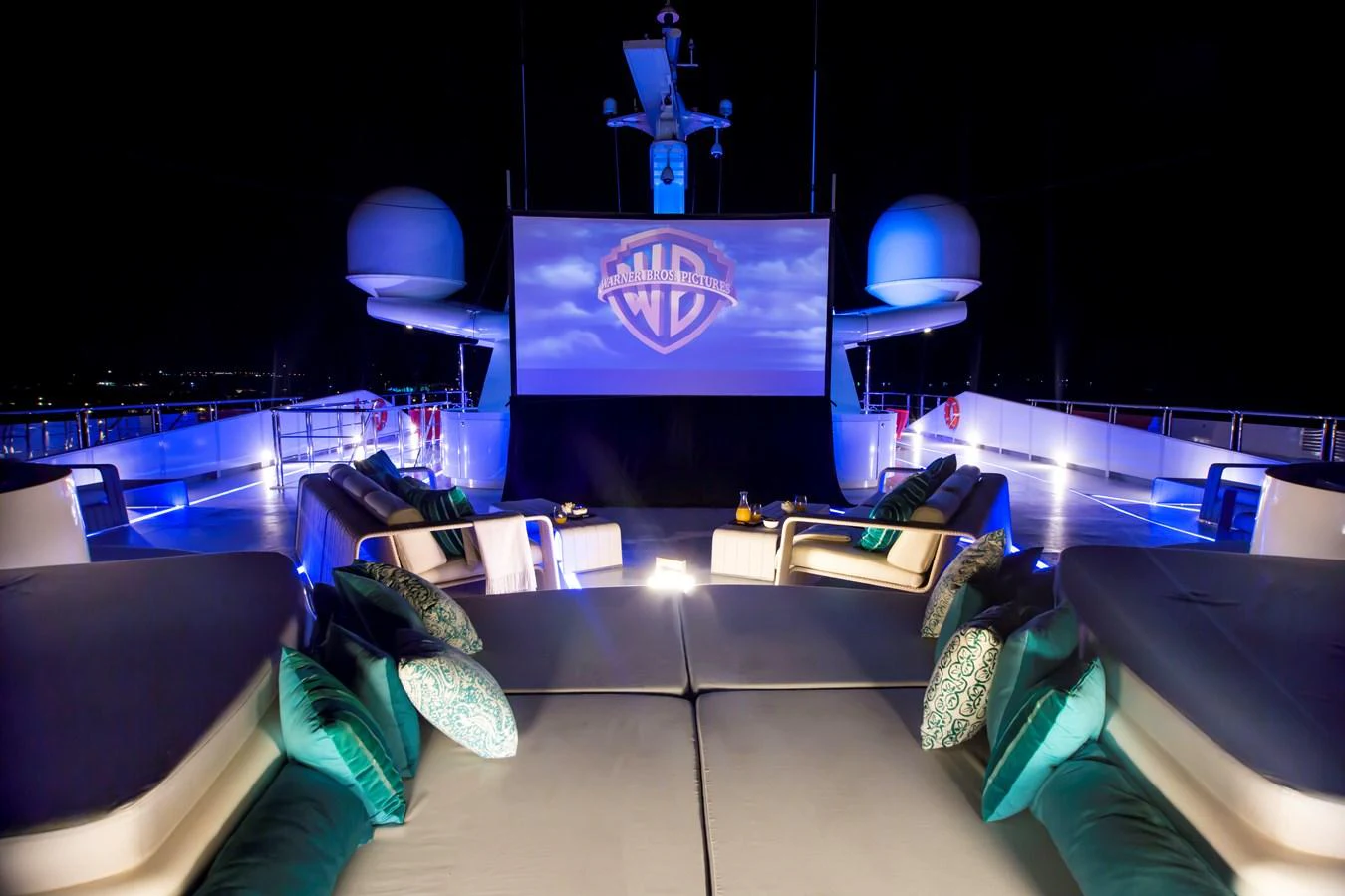 The yacht features a luxurious outdoor cinema with plush seating and ambient lighting for an exquisite movie-watching experience under the stars. aboard SALUZI Yacht for Sale