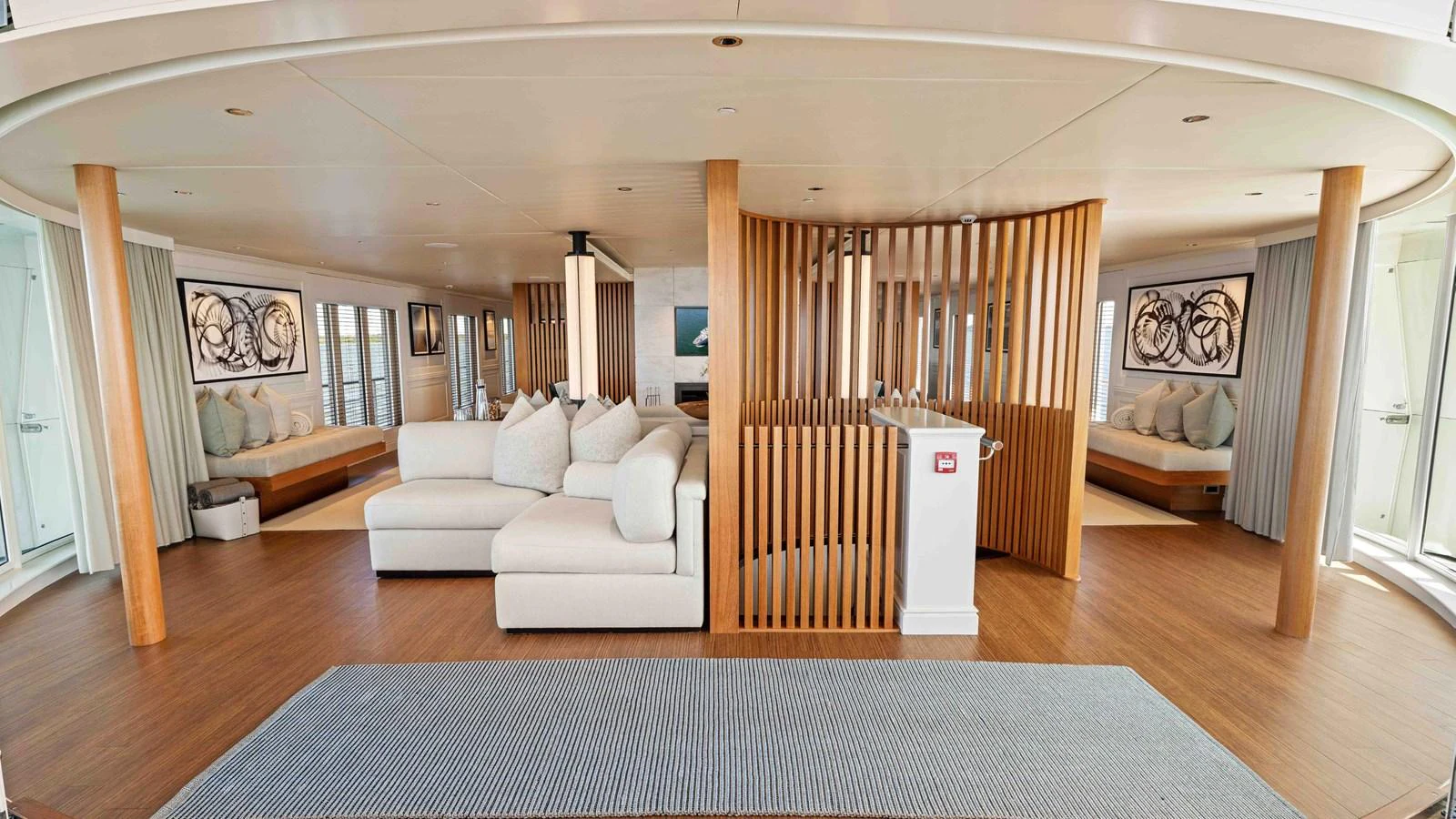 The spacious interior features a modern design with comfortable seating and elegant wooden accents. aboard JUST B Yacht for Sale