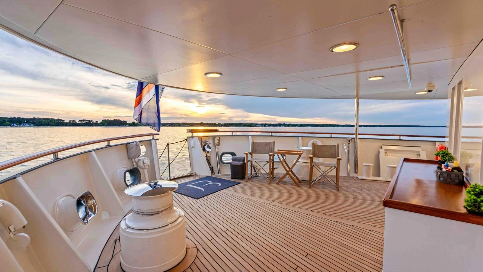 The aft deck offers a serene setting with comfortable seating and a beautiful view of the water. aboard JUST B Yacht for Sale