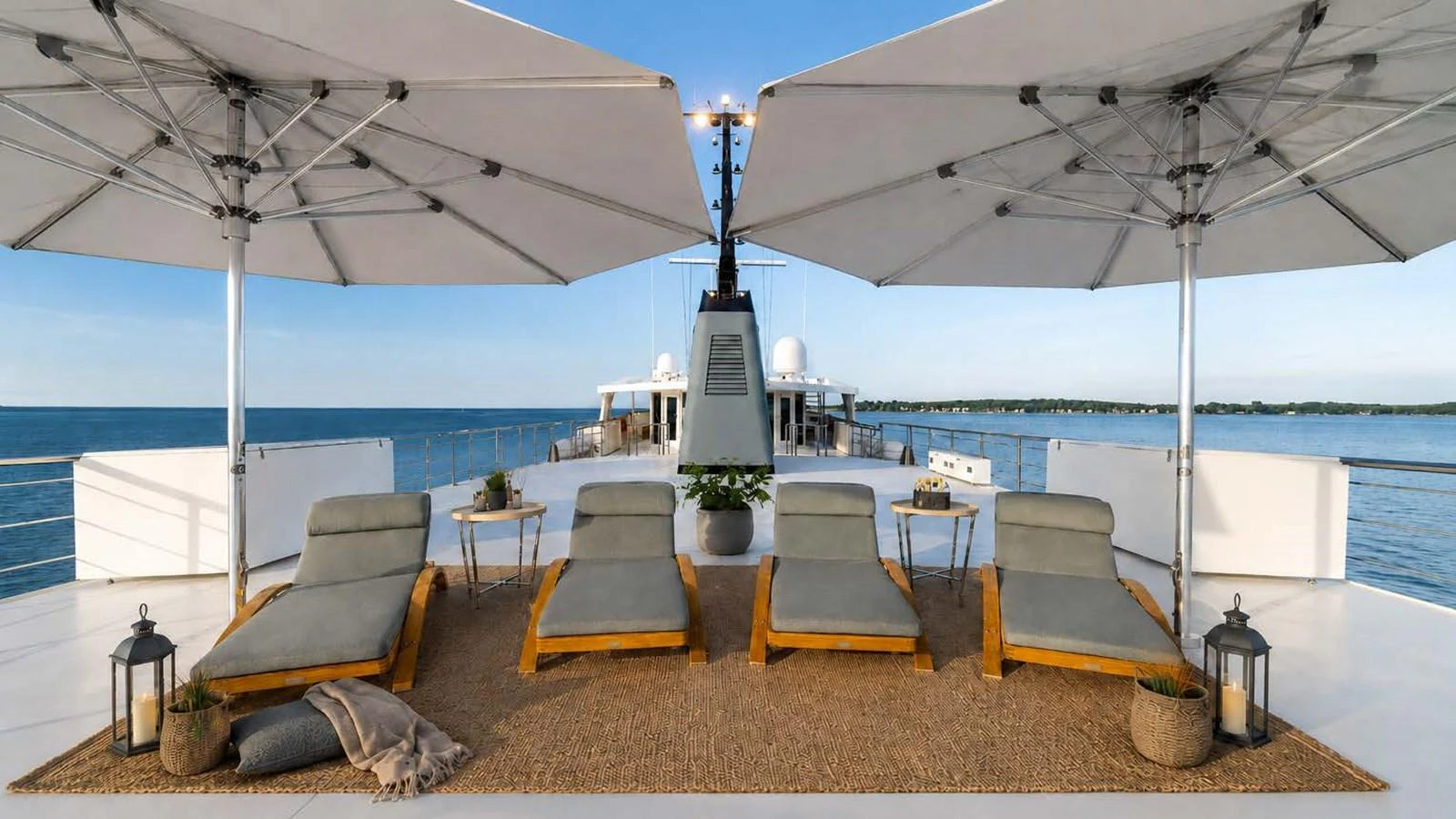 The sundeck offers a relaxing space with sun loungers and large umbrellas, perfect for enjoying the sea views. aboard JUST B Yacht for Sale