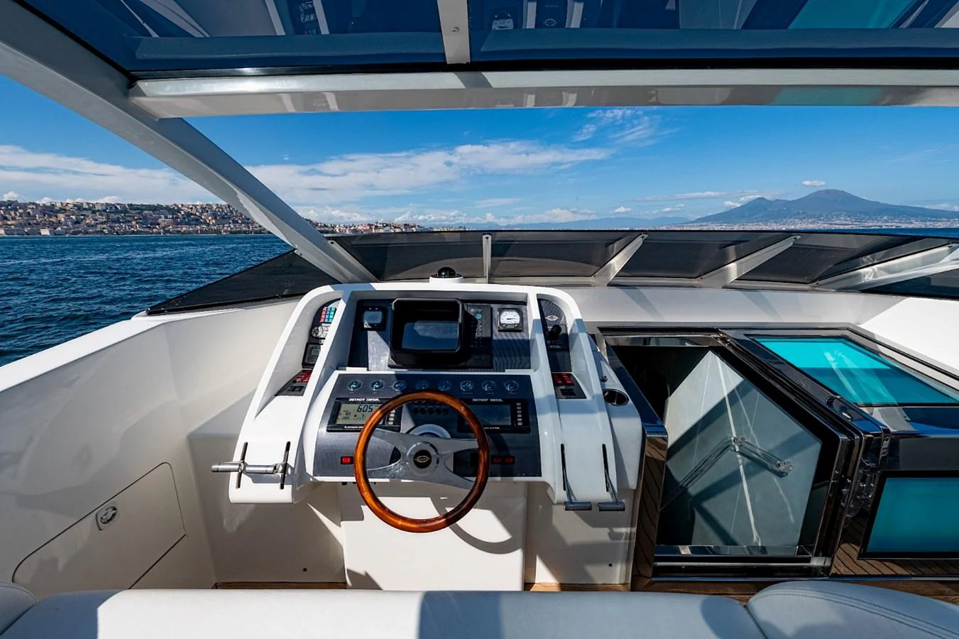 The helm station offers a commanding view with state-of-the-art navigation equipment and a sleek design. aboard WHITE & SILVER Yacht for Sale