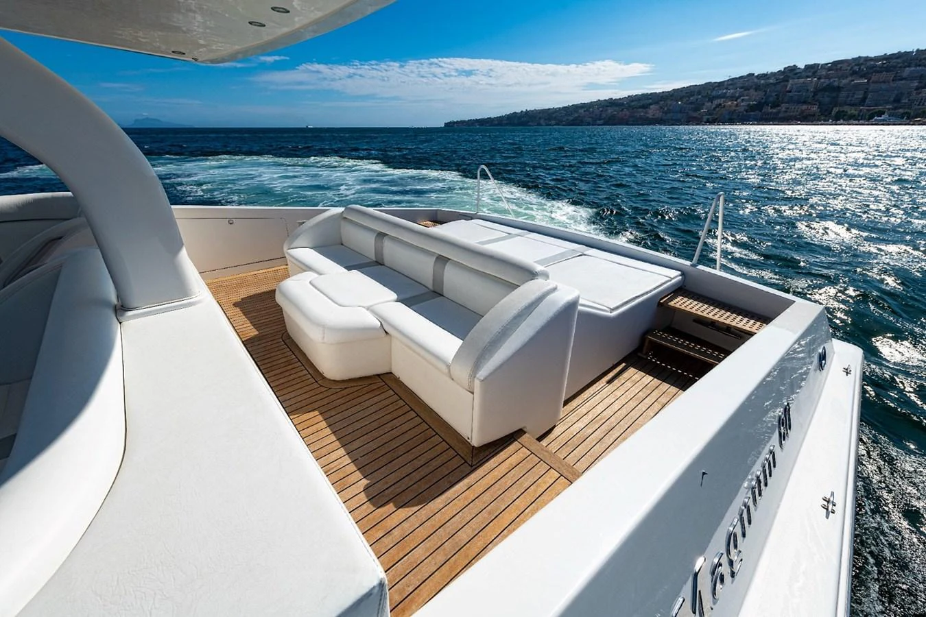 The aft deck features a spacious seating area with stunning views of the surrounding waters. aboard WHITE & SILVER Yacht for Sale