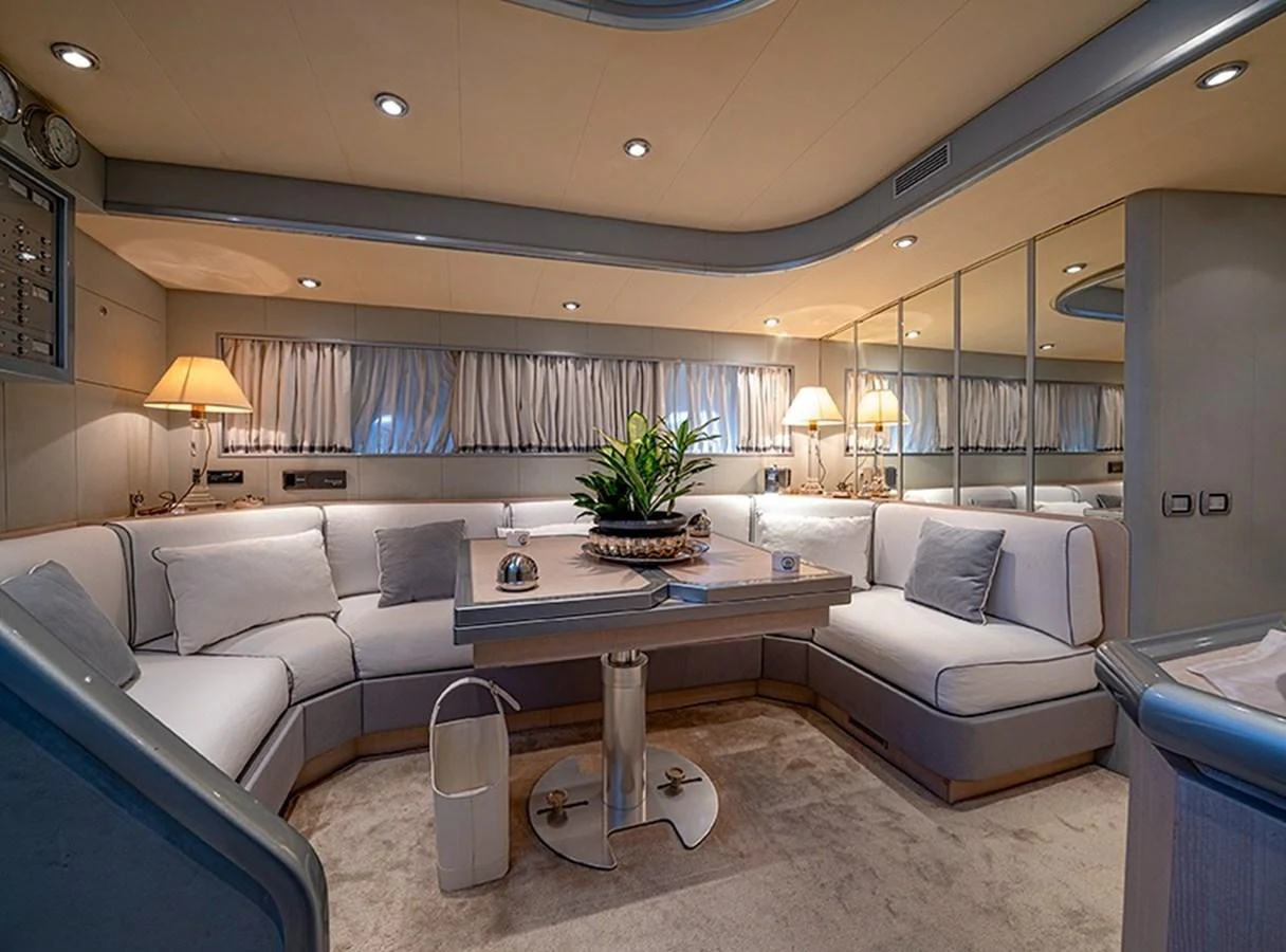 The salon offers a cozy and elegant seating area with soft lighting and tasteful decor. aboard WHITE & SILVER Yacht for Sale