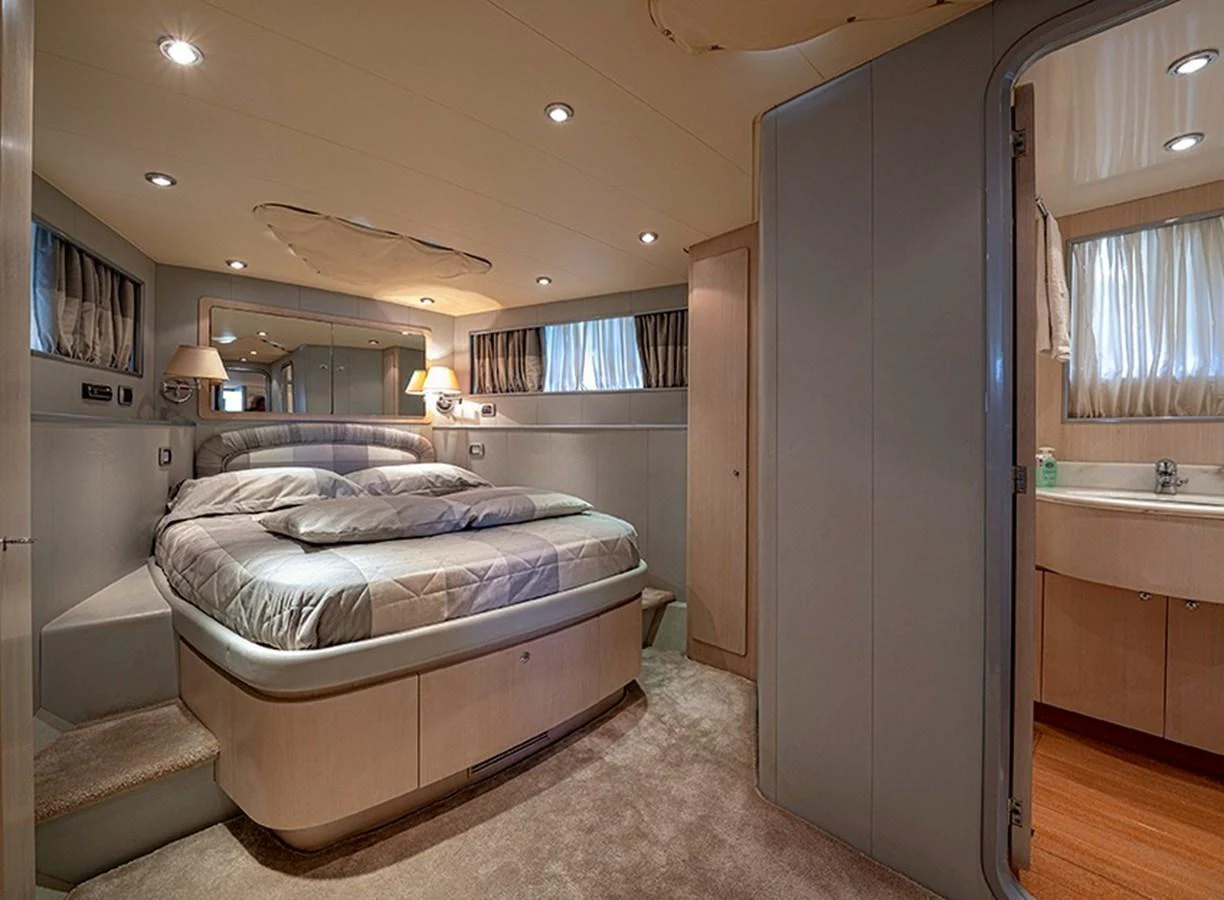 A cozy stateroom with a plush bed and ensuite bathroom, offering a serene retreat. aboard WHITE & SILVER Yacht for Sale