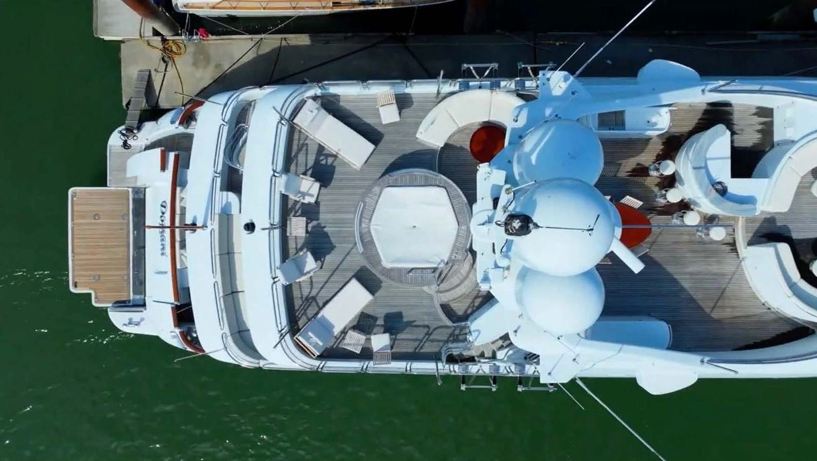 The yacht's sundeck offers ample seating and lounging areas, perfect for relaxation and entertainment. aboard DOMANI Yacht for Sale