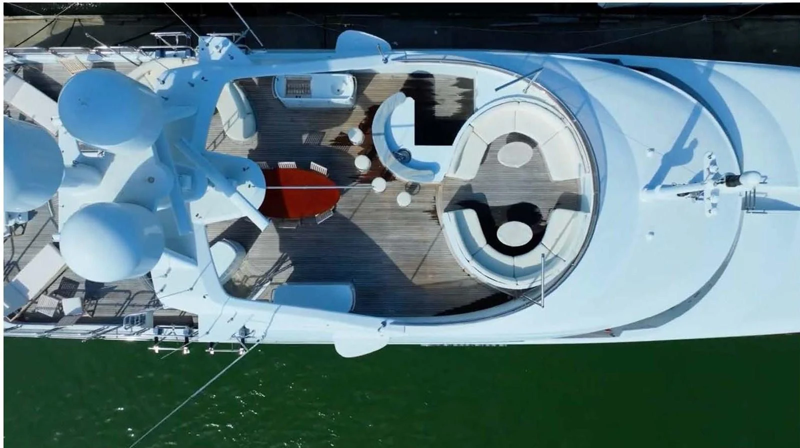The sundeck features ample seating and lounging areas with a modern design. aboard DOMANI Yacht for Sale