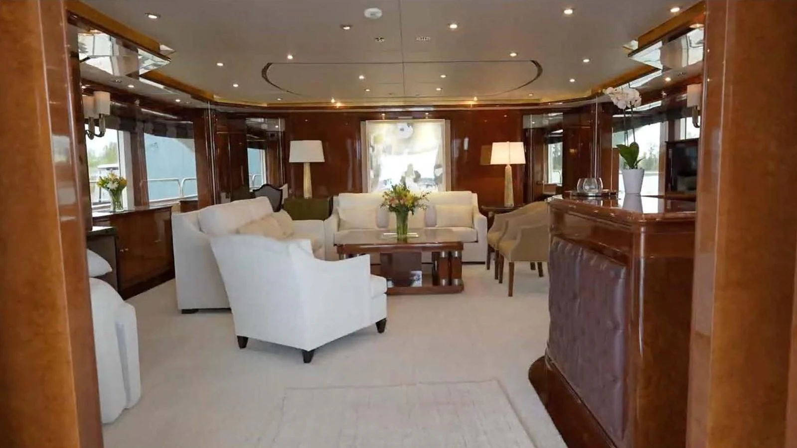 The yacht's salon features elegant seating and sophisticated decor, creating a luxurious and inviting atmosphere. aboard DOMANI Yacht for Sale