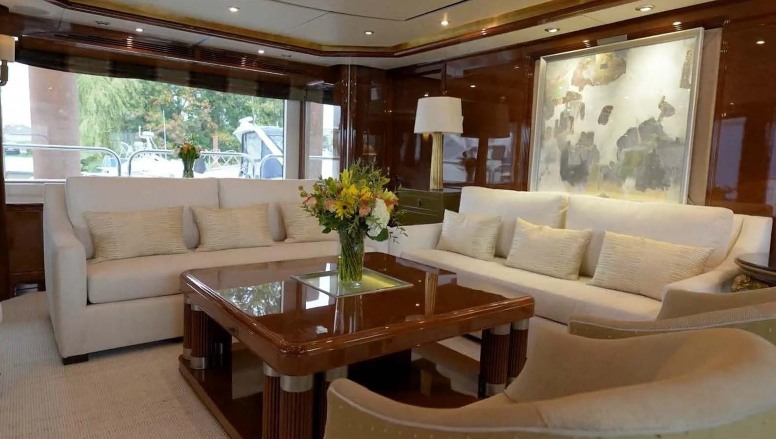 The salon features plush seating and elegant decor, creating a luxurious and inviting atmosphere. aboard DOMANI Yacht for Sale