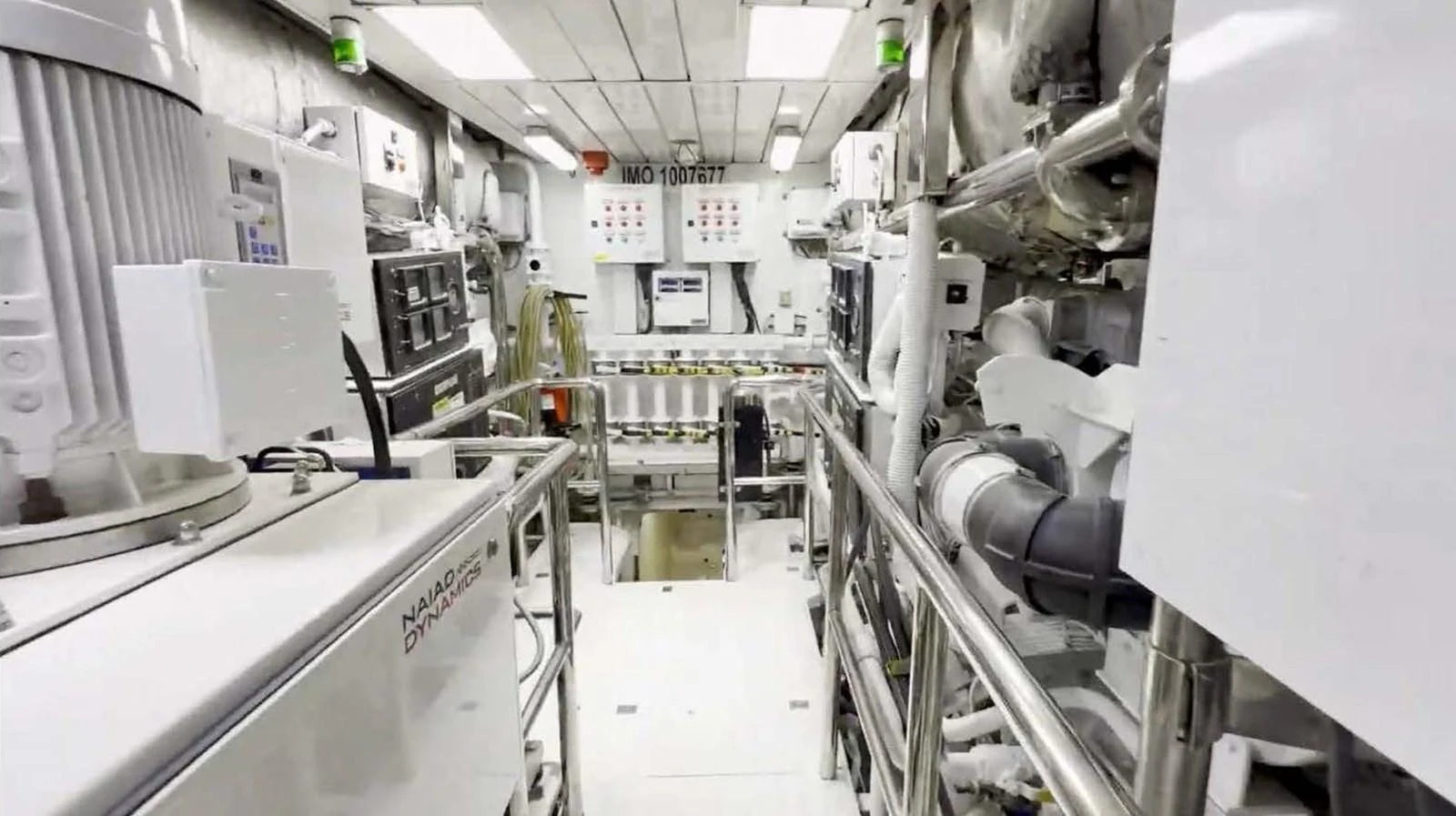 The yacht's engine room is equipped with advanced machinery and control panels, showcasing a clean and organized space. aboard DOMANI Yacht for Sale