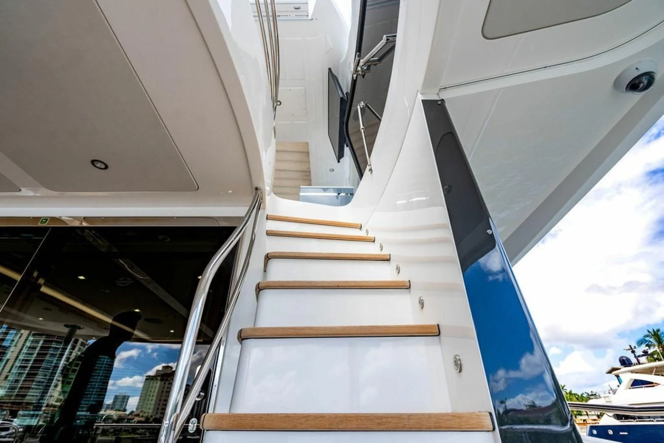 A sleek staircase leads to the upper deck, showcasing modern design and craftsmanship. aboard STAR OF THE SEA Yacht for Sale