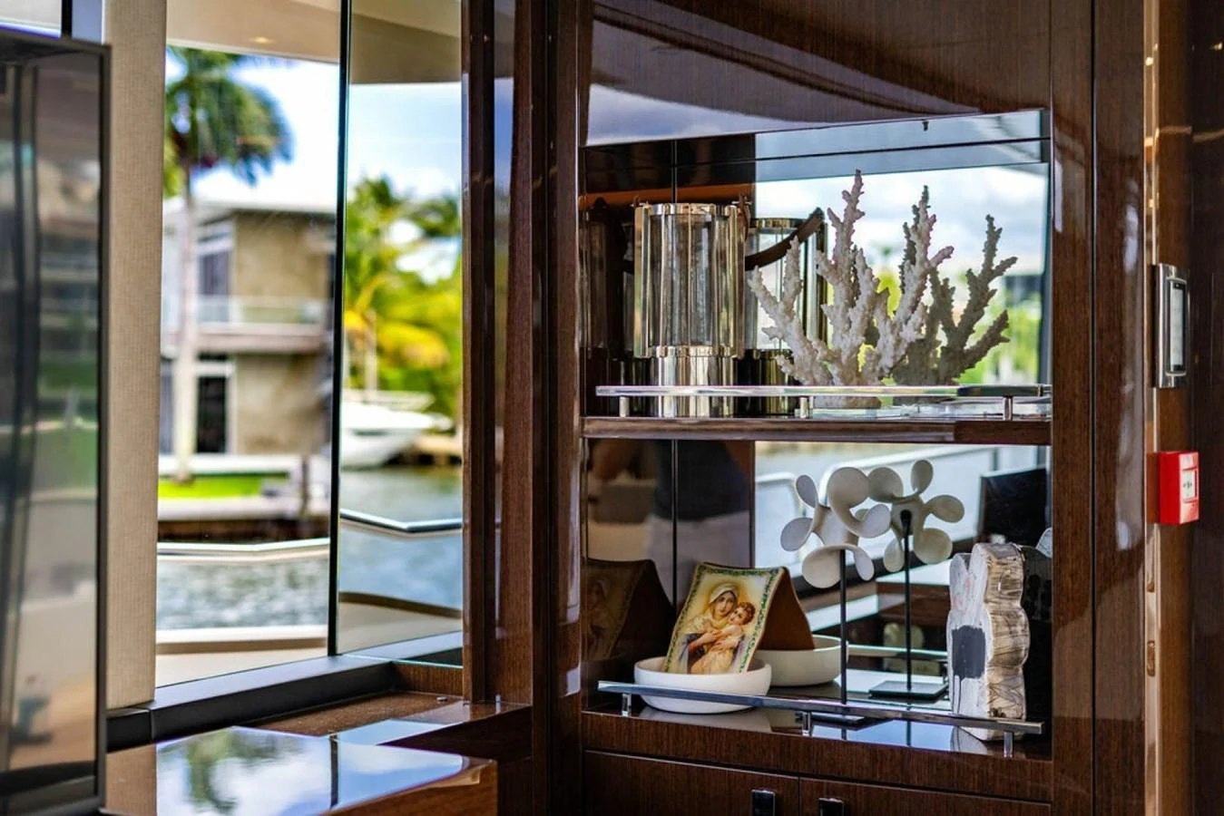 A tastefully decorated interior space featuring elegant decor and a view of the outside marina. aboard STAR OF THE SEA Yacht for Sale